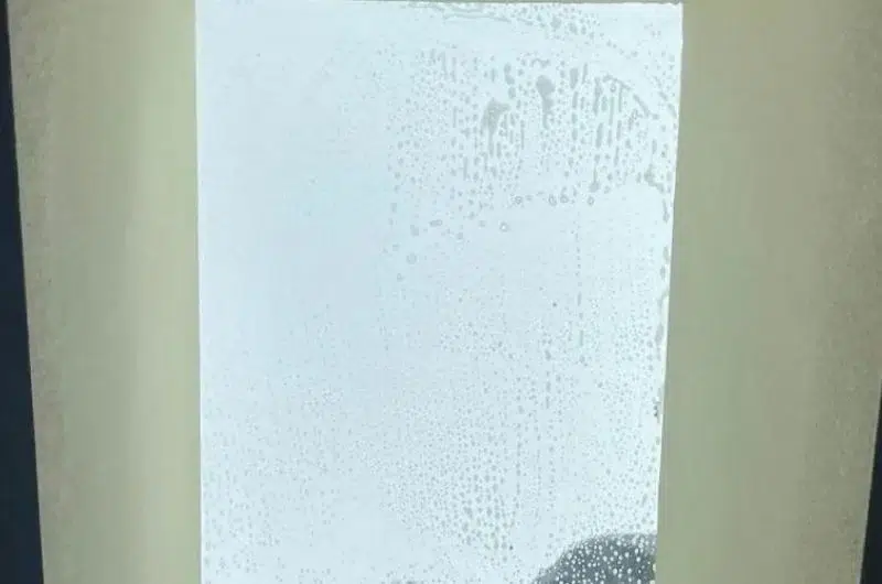 Skylight glass covered with soapy water during cleaning viewed from inside the home